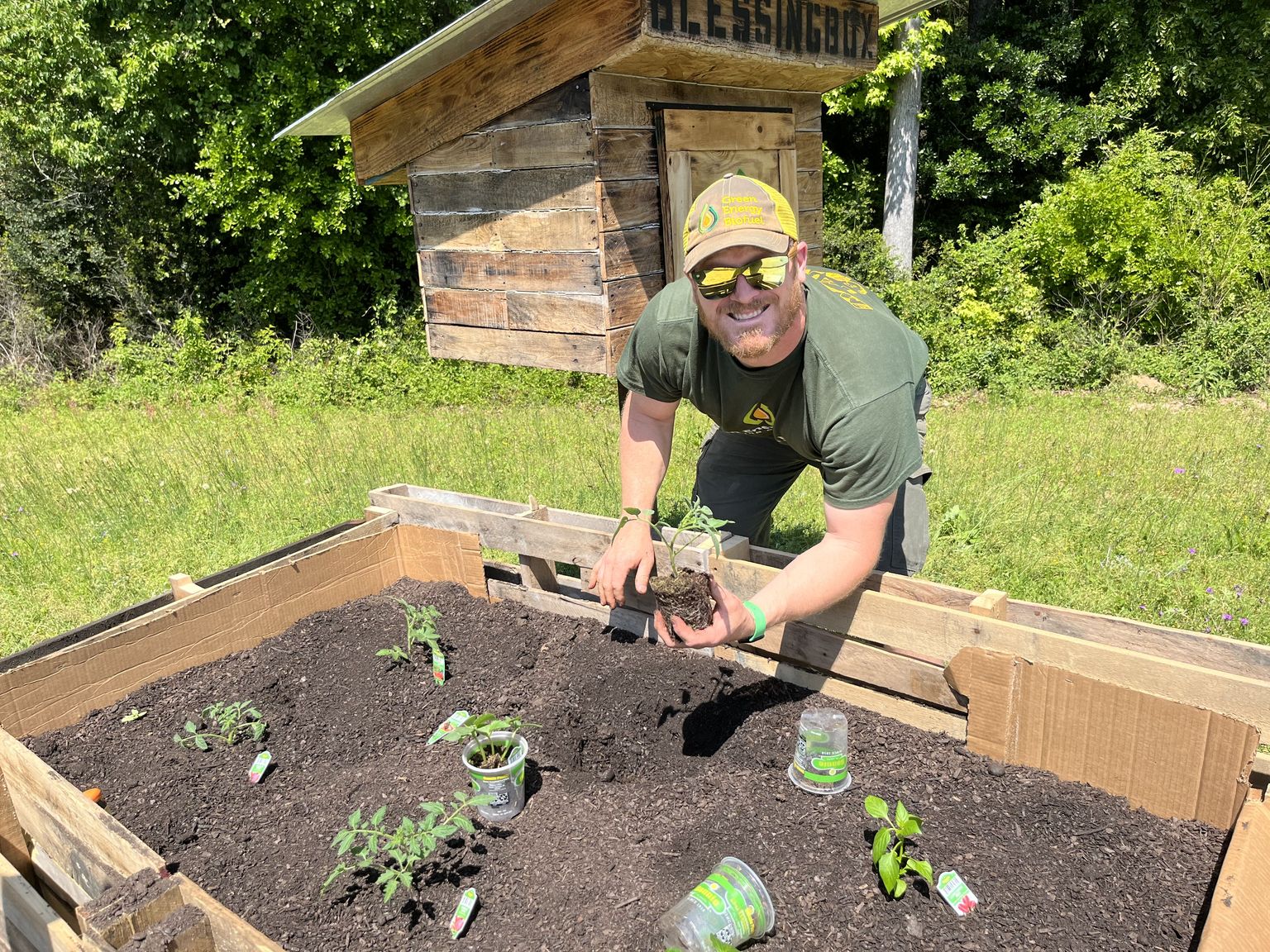 Joe Renwick planting at a community garden